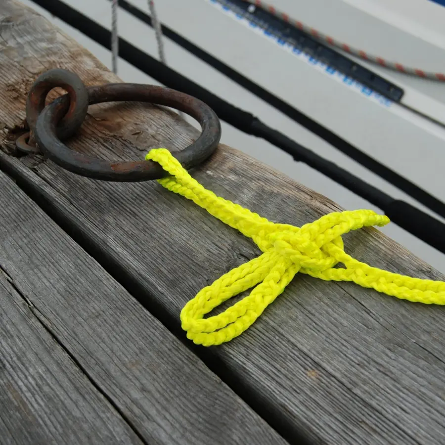 Yellow RunLock locked to a mooring ring on a jetty